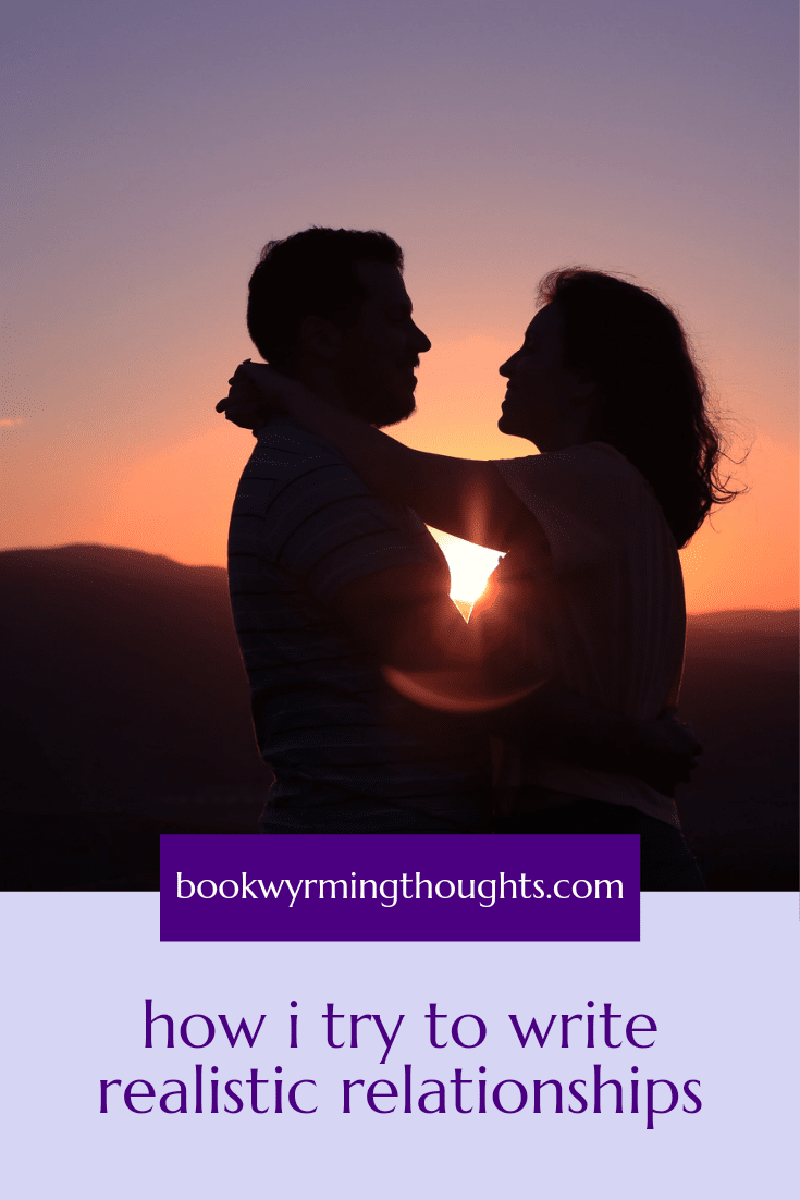 silhouette of embracing couple in front of setting sun