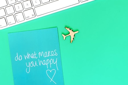 do-what-makes-you-happy-wood-plane-keyboard-bright-green-background